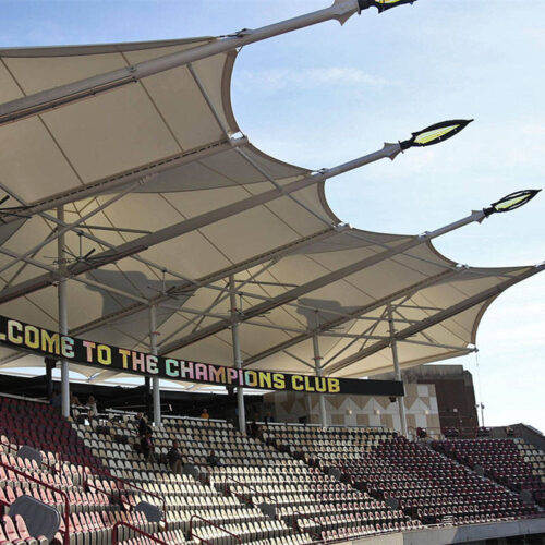 Mast-supported grandstand canopies
