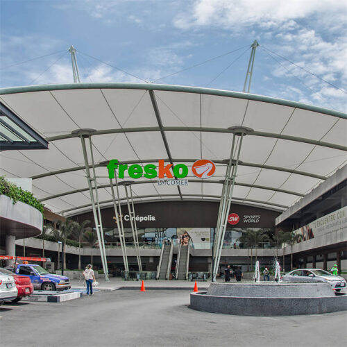 Arch-supported commercial covered entryway canopy